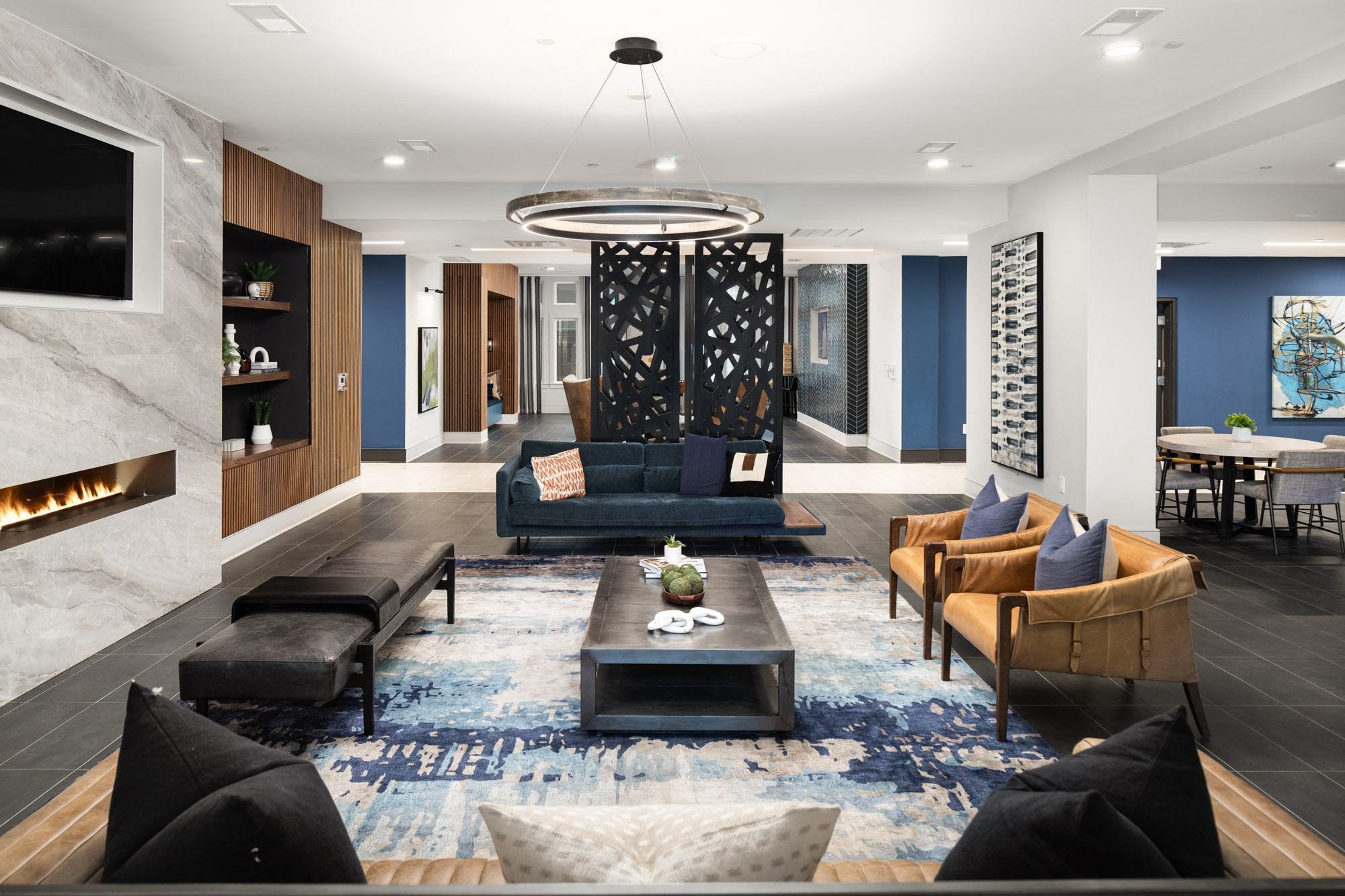 a living room with couches and chairs and a table